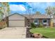 Charming brick home with a two-car garage, blue shutters, and well-manicured lawn at 4408 E 107Th Pl, Thornton, CO 80233