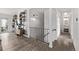 Second floor hallway leads to the bedroom and offers stairs to the first floor at 4408 E 107Th Pl, Thornton, CO 80233