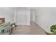 Hallway offers ample closet space, neutral colors, and wood floors leading to the bedroom at 4408 E 107Th Pl, Thornton, CO 80233