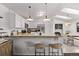 Bright kitchen featuring butcher block countertops, stainless steel appliances, and copper pendant lighting at 4408 E 107Th Pl, Thornton, CO 80233