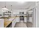 Well-appointed kitchen with butcher block counters, stainless steel appliances and modern fixtures at 4408 E 107Th Pl, Thornton, CO 80233