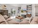 Comfortable living room with a fireplace, stylish shelving, a sliding glass door and wood floors at 4408 E 107Th Pl, Thornton, CO 80233
