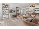 Inviting living room featuring stylish shelving, wood floors, and a cozy atmosphere at 4408 E 107Th Pl, Thornton, CO 80233