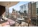 Cozy outdoor balcony offers city views with a table and chairs for relaxing at 1020 15Th St # 9K, Denver, CO 80202