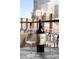 Balcony setup with the bottle of red wine and two wine glasses, overlooks the city skyline at 1020 15Th St # 9K, Denver, CO 80202