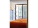 Bedroom balcony view with large sliding doors providing ample natural light at 1020 15Th St # 9K, Denver, CO 80202