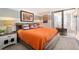 Comfortable bedroom with a queen-sized bed, a decorative headboard, and a private balcony at 1020 15Th St # 9K, Denver, CO 80202