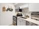 Modern kitchen features stainless steel appliances and white cabinets for storage at 1020 15Th St # 9K, Denver, CO 80202