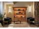 Inviting seating area with leather couches, tiled floors and display shelving at 1020 15Th St # 9K, Denver, CO 80202