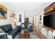 Inviting living room featuring comfortable blue couches, a stylish rug, and modern decor accents at 1020 15Th St # 9K, Denver, CO 80202