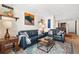 Comfortable living room with leather sofas, colorful rug, and stylish decor at 1020 15Th St # 9K, Denver, CO 80202