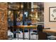 Residential lounge with a stylish modern table and chairs in front of a wall-sized window at 1020 15Th St # 9K, Denver, CO 80202