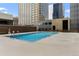 Rooftop outdoor pool with surrounding sundeck and views at 1020 15Th St # 9K, Denver, CO 80202
