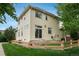 Backyard featuring a wood fence, a sliding glass door, and green grass at 10696 Riverbrook Cir, Highlands Ranch, CO 80126