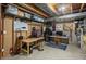 A finished basement with a workbench, desk, and organized storage at 10696 Riverbrook Cir, Highlands Ranch, CO 80126