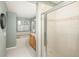 Bathroom with glass shower door, soaking tub, and sink with a wood vanity at 10696 Riverbrook Cir, Highlands Ranch, CO 80126