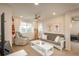 Cozy living room with neutral tones, a ceiling fan, and comfortable seating options at 10696 Riverbrook Cir, Highlands Ranch, CO 80126