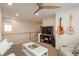 Upstairs living room features a large TV, ceiling fan, and comfortable seating at 10696 Riverbrook Cir, Highlands Ranch, CO 80126