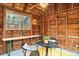 Charming outdoor shed featuring a picnic table, an outdoor dining table, and potted plants at 3719 W 30Th Ave, Denver, CO 80211
