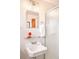 Bright bathroom featuring a glass shelf, sink, and mirror with a frosted glass shower at 3719 W 30Th Ave, Denver, CO 80211