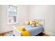 Charming bedroom with hardwood floors, bright window, and comfortable bed at 3719 W 30Th Ave, Denver, CO 80211