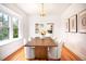 Elegant dining room with hardwood floors, natural light, and stylish furniture at 3719 W 30Th Ave, Denver, CO 80211