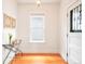 Bright entryway featuring hardwood floors, white walls, and vintage-style accents at 3719 W 30Th Ave, Denver, CO 80211