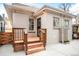 Back of house features a short deck constructed of wood with an interesting lattice detail at 3719 W 30Th Ave, Denver, CO 80211
