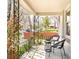 Inviting front porch with wrought iron railings, seating, and lush greenery at 3719 W 30Th Ave, Denver, CO 80211