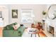 Inviting living room with hardwood floors, fireplace, and ample natural light at 3719 W 30Th Ave, Denver, CO 80211