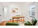 Inviting home office with hardwood floors, a desk, comfortable seating, and ample natural light at 3719 W 30Th Ave, Denver, CO 80211