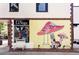 Quaint La Voga boutique storefront, featuring a unique mushroom mural and charming display window at 3719 W 30Th Ave, Denver, CO 80211