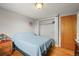 Bedroom features wood floors and a spacious closet, offering a comfortable living space at 10805 Verna Ln, Northglenn, CO 80234