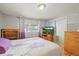 Bedroom with hardwood floors, natural light, and closet space, creating a comfortable and functional area at 10805 Verna Ln, Northglenn, CO 80234