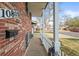A charming front porch view with brick detail and white picket fence at 10805 Verna Ln, Northglenn, CO 80234