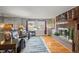 Bright living room featuring a brick fireplace, hardwood floors, and neutral paint at 10805 Verna Ln, Northglenn, CO 80234