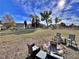 This expansive backyard offers ample space for outdoor activities, with additional seating and mature trees at 371 S Estes St # 10, Lakewood, CO 80226