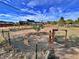 A large backyard is enclosed by a chain link fence with a private property sign at 371 S Estes St # 10, Lakewood, CO 80226