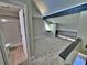 The carpeted bedroom features an ensuite bathroom, attic roof and painted walls with trim at 371 S Estes St # 10, Lakewood, CO 80226