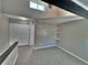 Bedroom featuring carpeted floors, attic ceiling with sky light, and wall mounted shelves at 371 S Estes St # 10, Lakewood, CO 80226