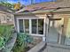 The unit exterior has a window view of the laundry room and a covered porch at 371 S Estes St # 10, Lakewood, CO 80226