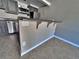 Kitchen featuring breakfast bar with granite countertops and stainless steel appliances on tile floors at 371 S Estes St # 10, Lakewood, CO 80226