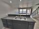 Bright kitchen featuring bar seating and sleek countertops at 371 S Estes St # 10, Lakewood, CO 80226