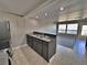 Bright open kitchen featuring bar seating, stainless steel appliances, and sleek countertops at 371 S Estes St # 10, Lakewood, CO 80226
