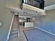 Inviting living room with stairs, stainless steel appliances and gray walls at 371 S Estes St # 10, Lakewood, CO 80226