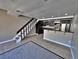 A cozy living room with stairs, stainless steel appliances and gray walls at 371 S Estes St # 10, Lakewood, CO 80226
