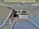 Living room with stairs, stainless steel appliances and gray walls at 371 S Estes St # 10, Lakewood, CO 80226
