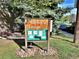 A street sign details the neighborhood with wooden posts and green accents at 371 S Estes St # 10, Lakewood, CO 80226