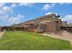Backyard featuring large lawn, wooden fence, patio, and hot tub at 7877 E 139Th Pl, Brighton, CO 80602
