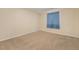 Neutral bedroom featuring carpet flooring, and a blue curtain at 7877 E 139Th Pl, Brighton, CO 80602